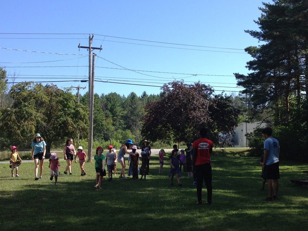 Children play outdoors at camp