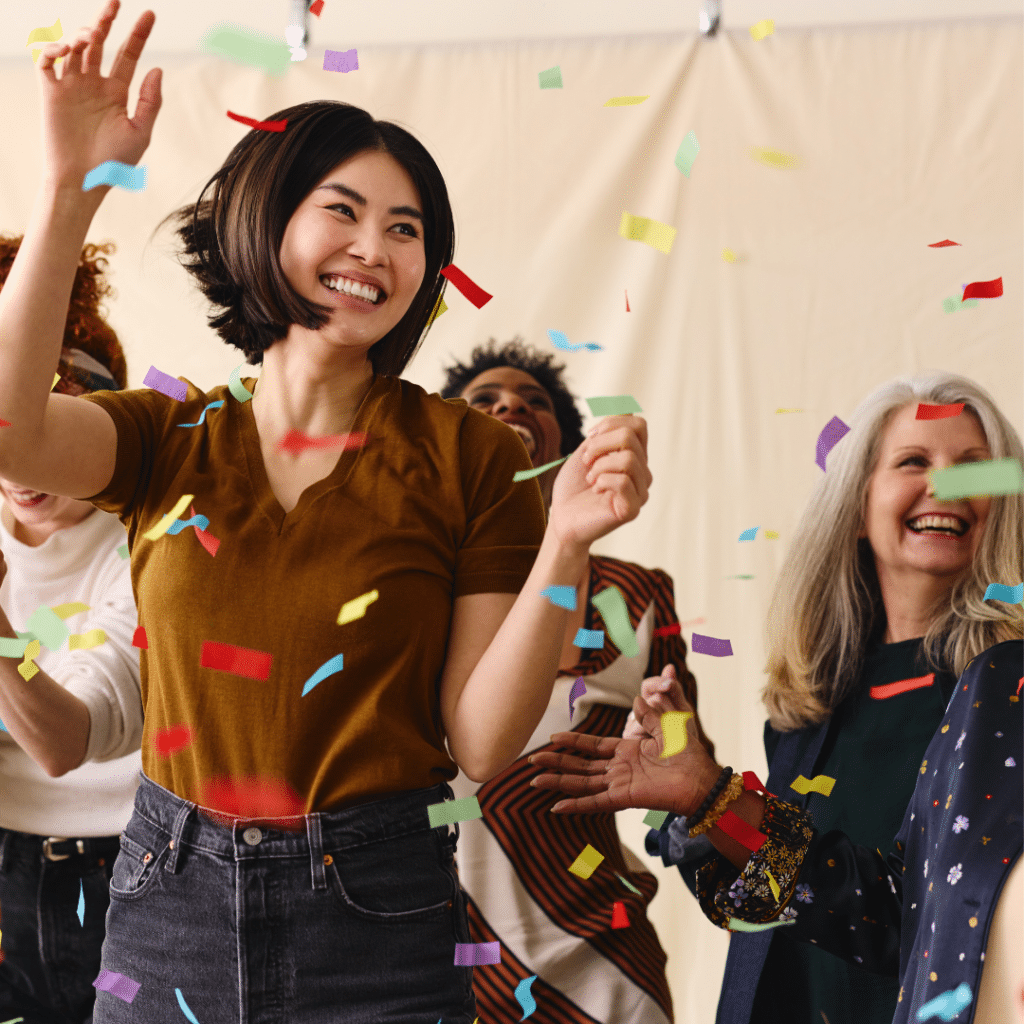 Group of women of all ages and races celebrating